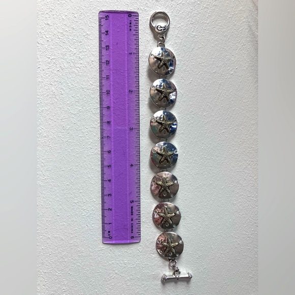 Silver sand dollar link bracelet. 7” includes clasp. - Picture 2 of 7